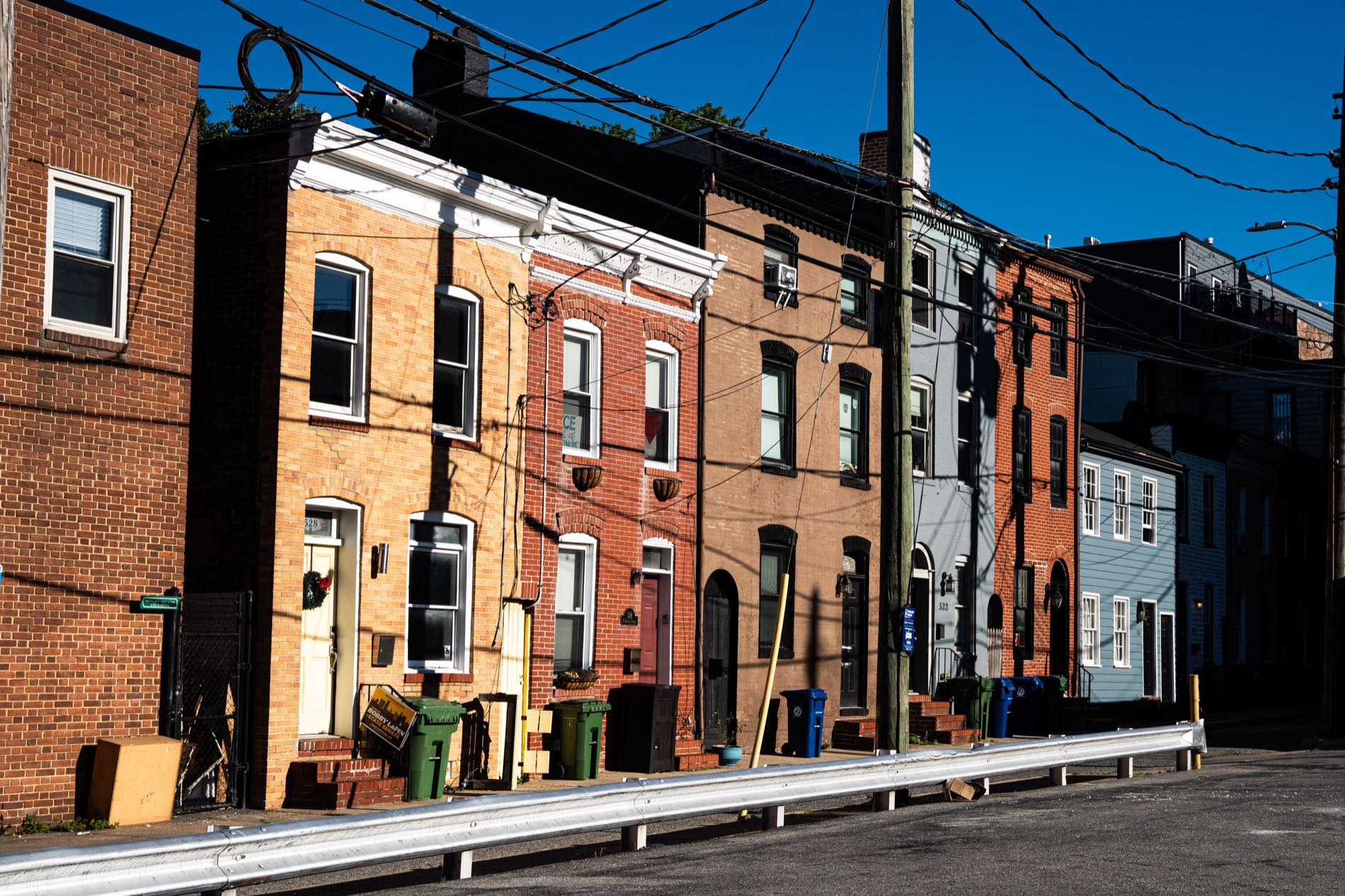 A row of Baltimore rowhouses in early morning light